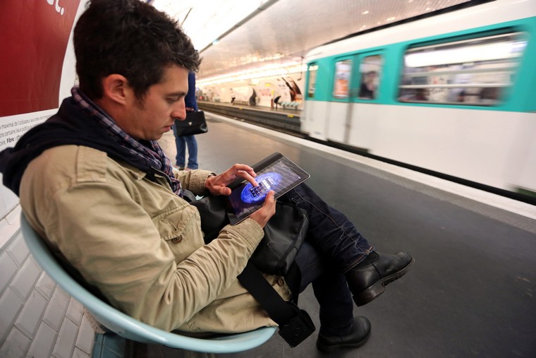 A man poses with a tablet on June 26, 20