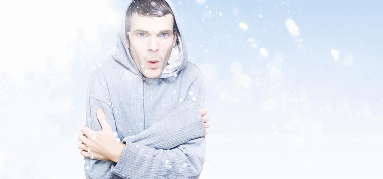 Man freezing in cold winter snow