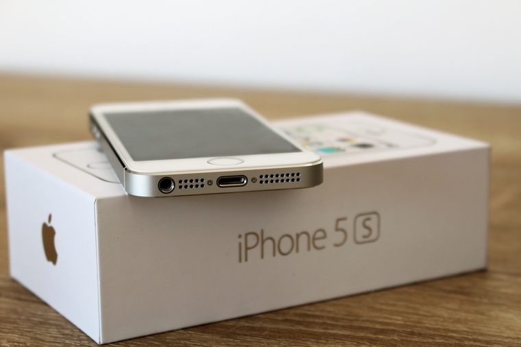 Modern white iPhone 5s on the original box